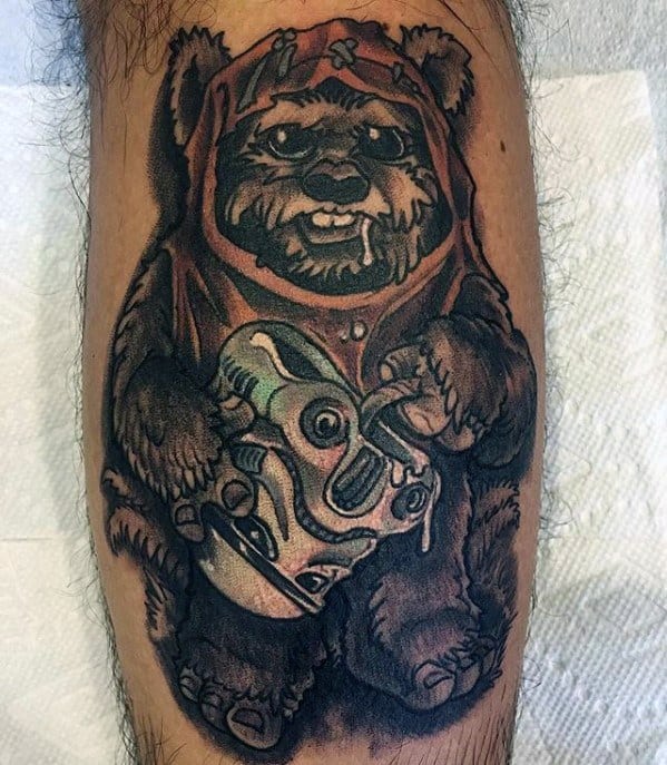 Bold Ewok tattoo with an orange hood, holding a detailed Stormtrooper helmet, featuring heavy black outlines and rich shading.