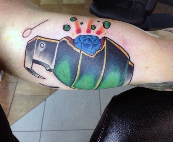 Men's Exploding Grenade Tattoo On Bicep With Blue Diamond