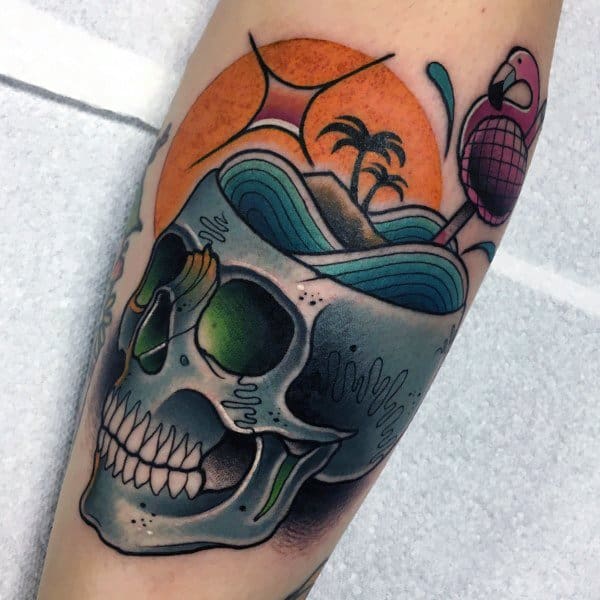 Surreal flamingo tattoo with a tropical island and ocean scene emerging from a skull, blending bold colors and imaginative elements.