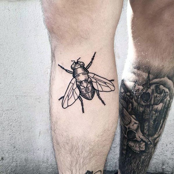 Large black line fly tattoo on the calf with detailed wings and fine textures, designed to resemble a realistic anatomical sketch.