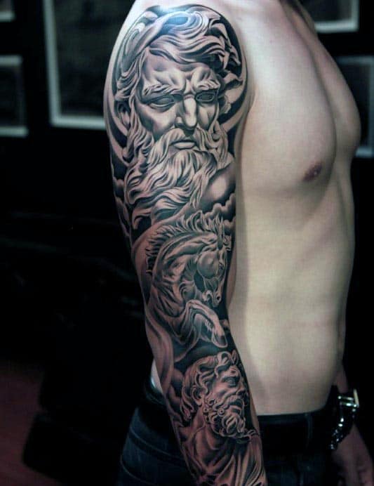 Black and gray sleeve tattoo featuring a detailed mythological figure with long hair and beard, covering a person's upper arm