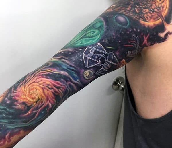 Colorful space-themed tattoo sleeve featuring galaxies and spaceships