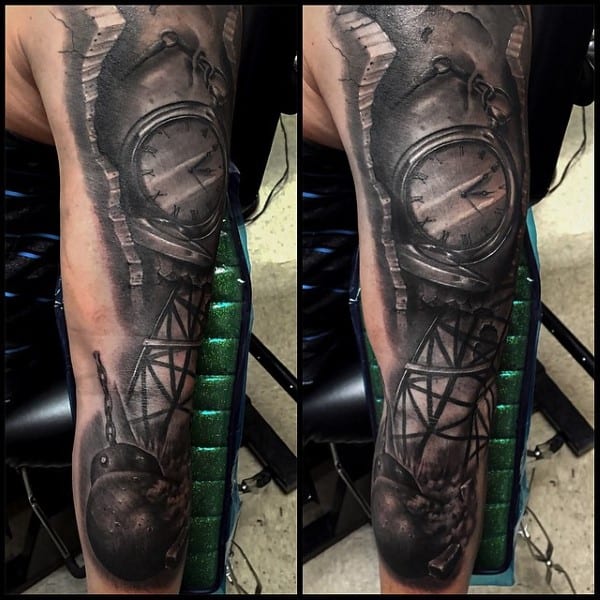 Mens Full Sleeve Tatto Of Wrecking Ball Smashing Through Stone