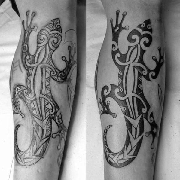 Polynesian-style gecko tattoo on leg with intricate tribal patterns, bold outlines, and a flowing, symmetrical design.