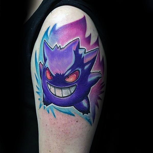 Energetic Gengar shoulder tattoo with vivid red eyes, a wide grin, and electric blue and purple aura for a bold and dynamic look.