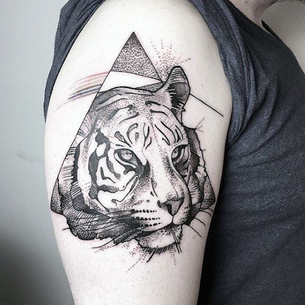 Upper arm tiger tattoo with a mix of realism and geometric framing, featuring fine linework, dot shading, and a subtle prism rainbow.