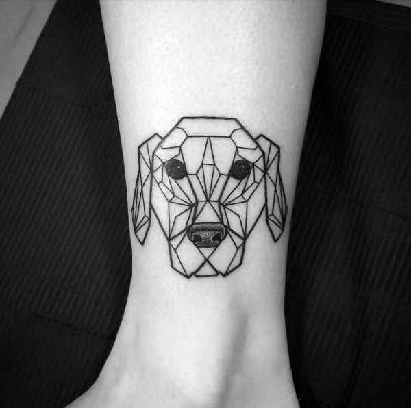 Geometric Golden Retriever tattoo on the ankle, featuring clean black linework and intricate polygonal shapes for a modern, minimalist design.