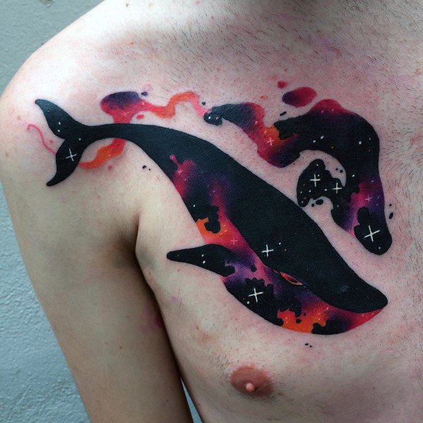Cosmic whale tattoo on the chest with a silhouette filled with galaxy-inspired gradients of black, purple, and red, accented by stars.