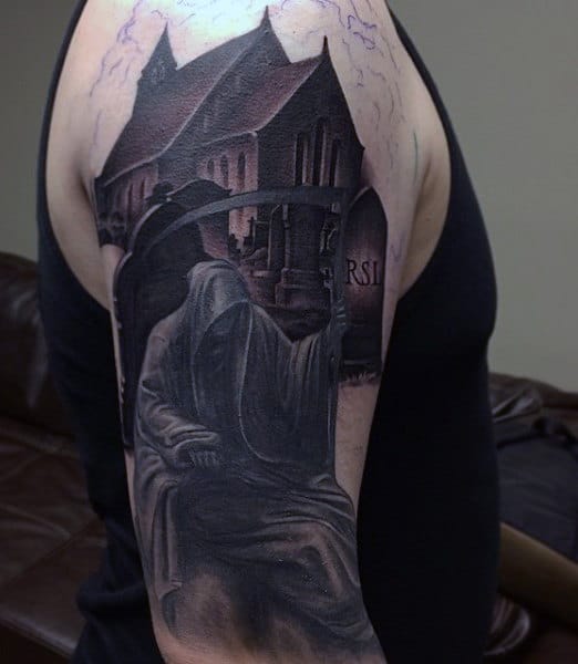 Forearm tattoo featuring a hooded figure with a scythe, standing in front of a gothic building, and surrounded by an eerie graveyard