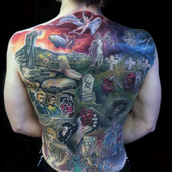 Full back tattoo featuring a vivid collage of Green Day imagery, including the heart grenade, cartoon bunny, tombstones, and dramatic scenes.