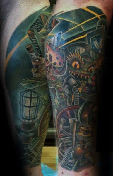 Detailed Gremlin tattoo with a mechanical steampunk theme, featuring gears, pipes, and a fierce expression for a dark, industrial look.