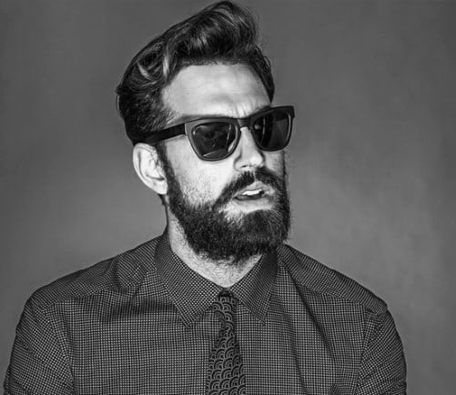 Man with styled hair and a full beard