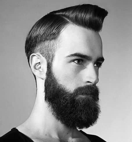 Man with a slicked-back undercut and full beard