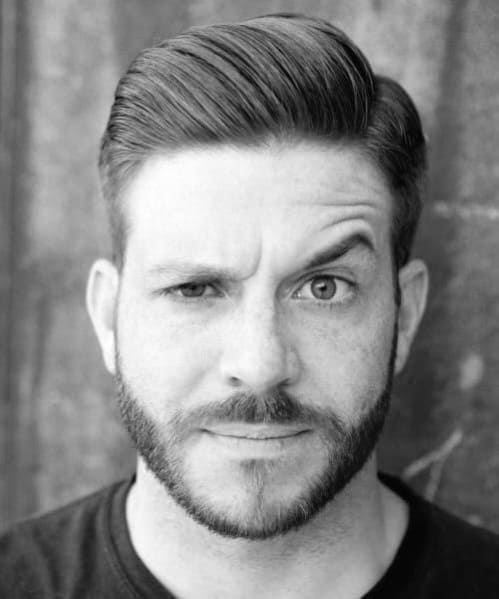 Classic side part with a sleek, combed-back finish