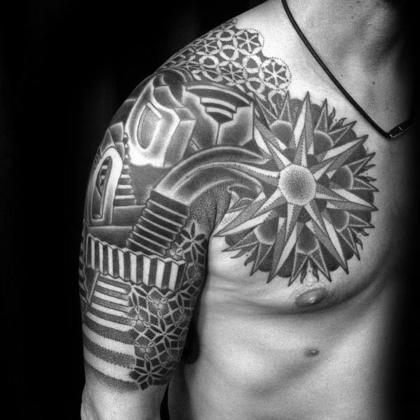 MC Escher-inspired shoulder and arm tattoo featuring geometric patterns, impossible staircases, and a starburst design blending surreal elements.