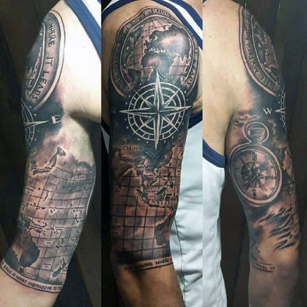 Arm tattoos featuring maps, compass, and nautical themes on a man's upper arm
