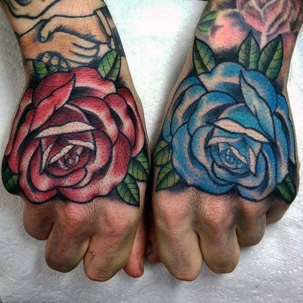 Hands with colorful rose tattoos, one red on the left and one blue on the right