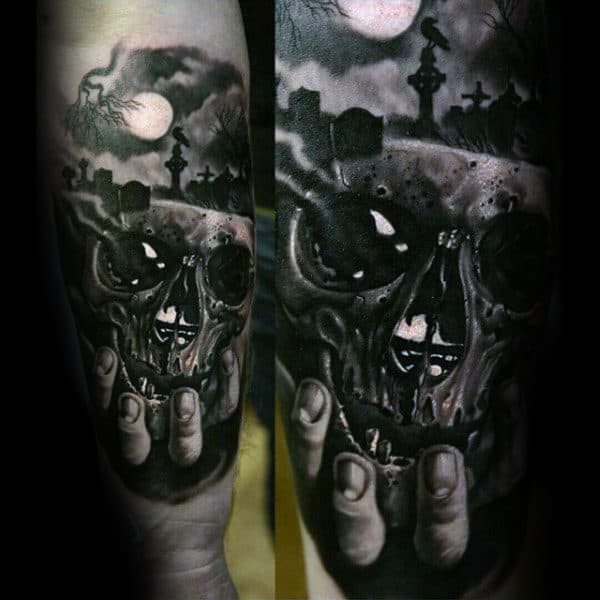 Mens Hand Holding Skull In Graveyard Inner Forearm Tattoos