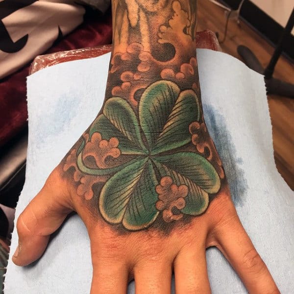 Mens Hand Tattoo Of Four Leaf Clover With Clouds