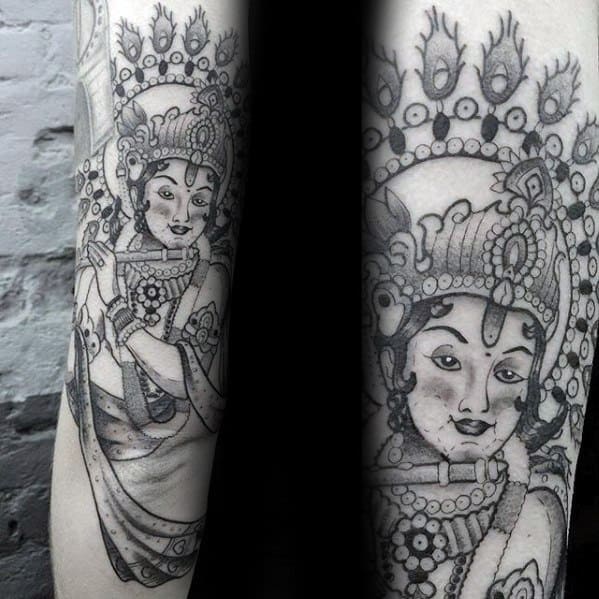 Black and grey Krishna tattoo with bold outlines and dotwork, showing Krishna adorned in intricate jewelry and crown, playing the flute.