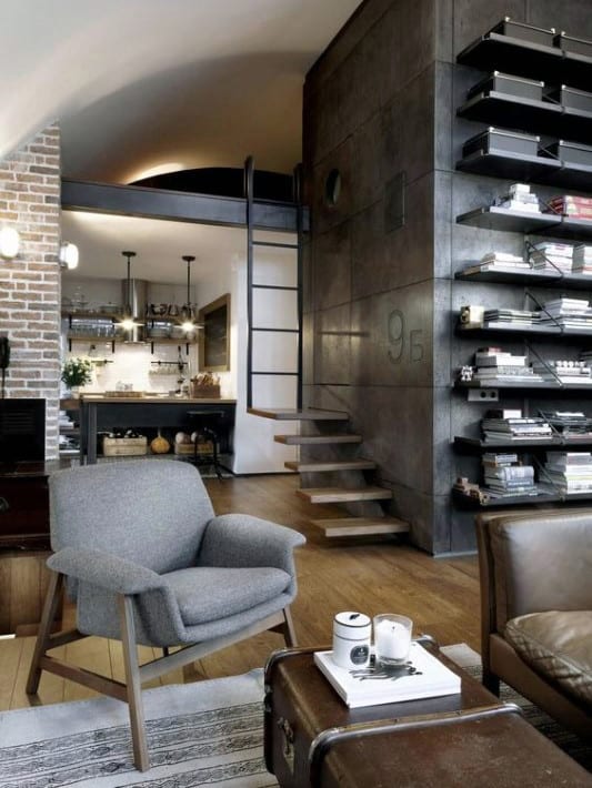 Modern living room with industrial shelving, loft ladder, and cozy seating area.