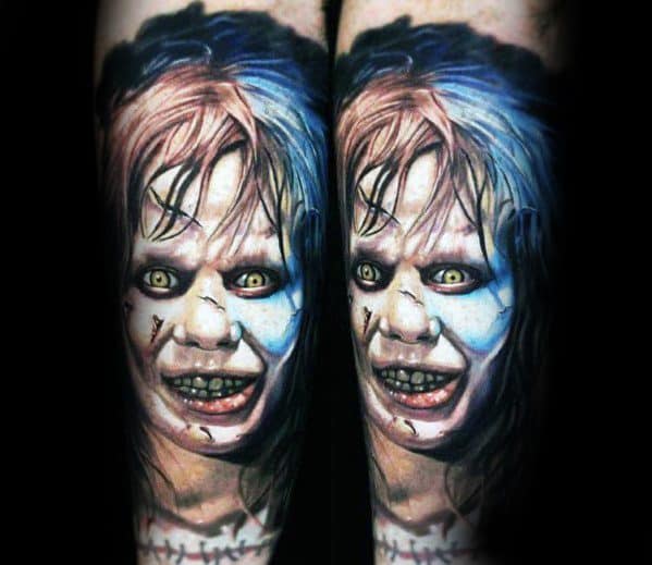 Realistic color tattoo of Regan from *The Exorcist*, featuring her possessed face, glowing yellow eyes, and eerie wounds for a terrifying horror design.