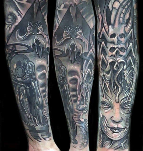 HR Giger-style sleeve tattoo featuring alien figures, skulls, a haunting biomechanical face, and surreal pyramid and space elements.