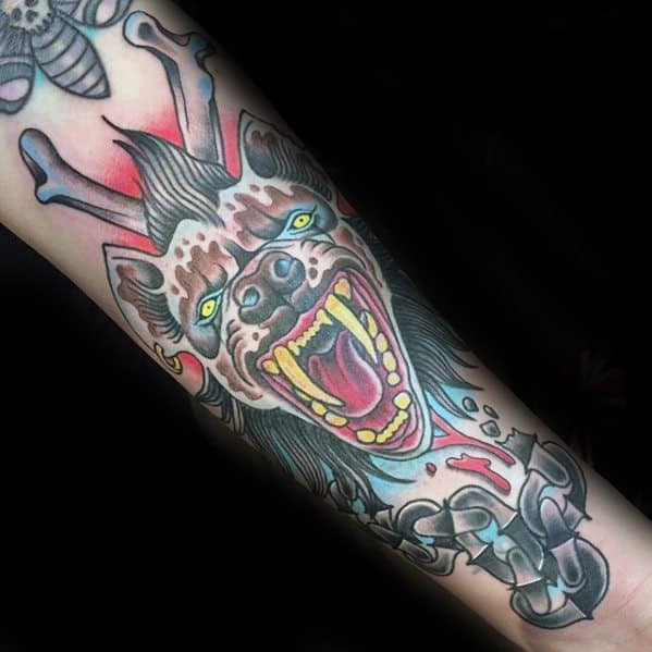 Neo-traditional hyena tattoo with glowing green eyes, wide open jaws, shattered chains, and red energy spikes, symbolizing wild power and rebellion.
