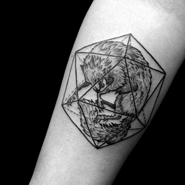 Intricate fox tattoo curled inside an icosahedron, blending natural detail with geometric structure on the forearm.