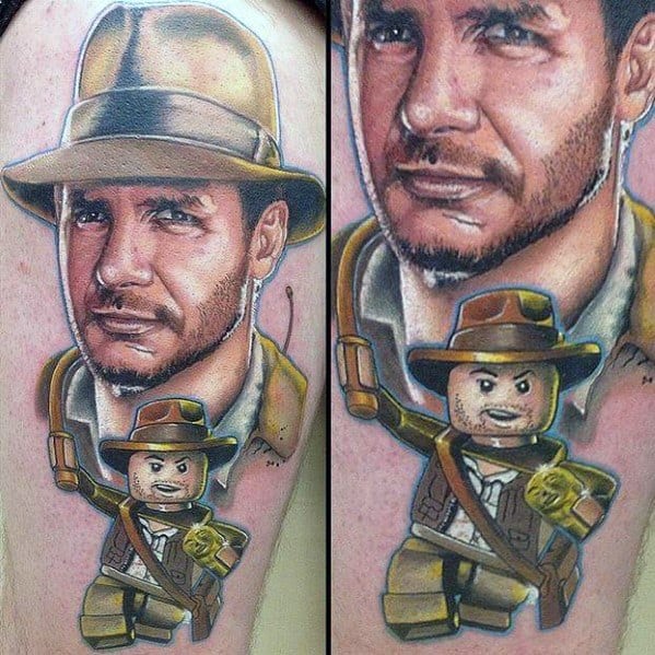 Vibrant tattoo featuring a realistic Indiana Jones portrait paired with a playful LEGO Indiana Jones figure, blending adventure and nostalgia.
