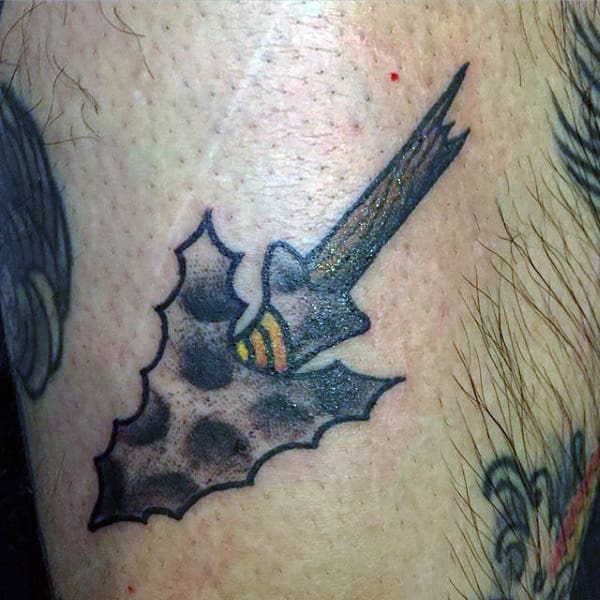 Mens Iron Grey Arrowhead Tattoo With Yellow Pattern On Torso