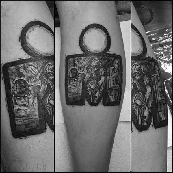 Tattoo showing the Ironman logo with detailed scenes of swimming, cycling, and running, capturing the stages of the triathlon in black and grey shading.
