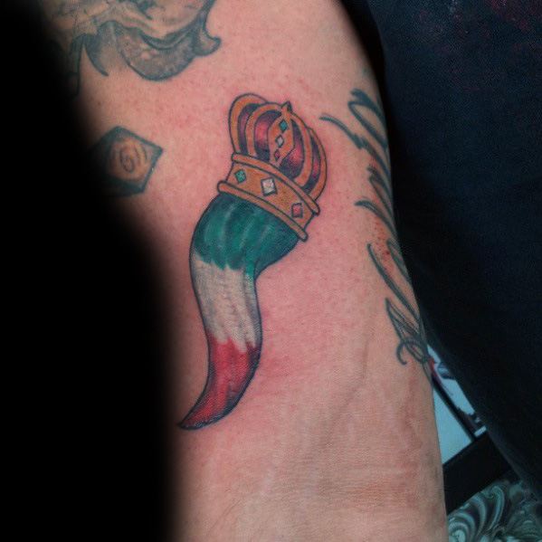 Italian horn tattoo with a golden crown and tricolor design, symbolizing heritage, luck, and protection.