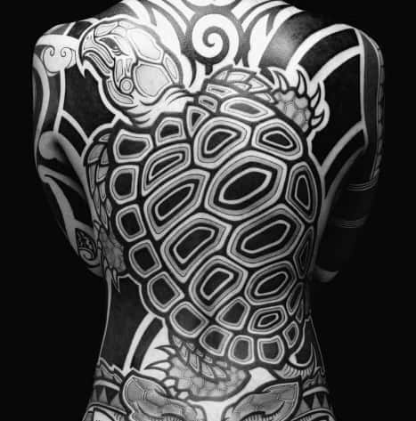 Black and grey Japanese-style full-back tattoo featuring a bold turtle design with intricate shell patterns and flowing wave elements.