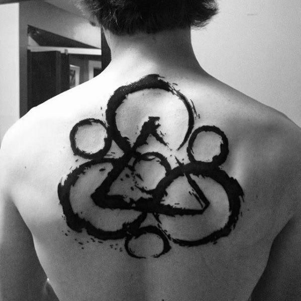 Large Coheed and Cambria Keywork tattoo in bold black brushstrokes centered on the upper back, creating a powerful and artistic statement.