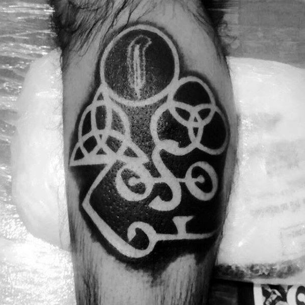 Bold blackwork tattoo featuring the four Led Zeppelin symbols—Zoso, triquetra, Borromean rings, and feather—in negative space against a dark background.