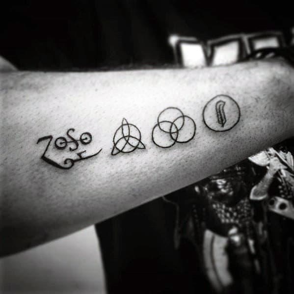 Minimalist forearm tattoo of the four Led Zeppelin symbols: Zoso, triquetra, Borromean rings, and feather in a circle.