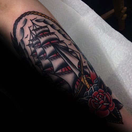 Mens Leg Tattoo Design With Traditional Sailing Ship And Red Rose Flower Design