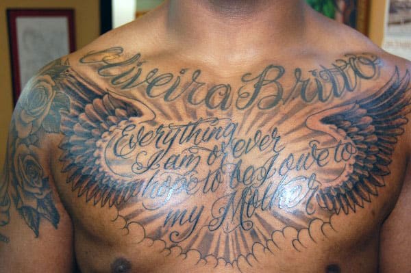 Chest tattoo with wings and script: "Everything I am or ever hope to be, I owe to my Mother"