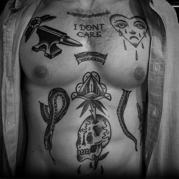 Blackwork chest tattoo collection featuring an anvil with flowers, text saying "I DON'T CARE," a crying heart, snake, skull, and ornamental elements.