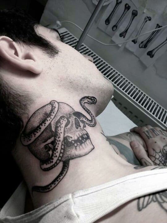 Person with a tattoo of a skull wrapped by a snake on their neck
