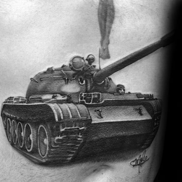 Realistic black and grey tattoo of a Soviet-style tank with bold shading, angled perspective, and intricate mechanical detailing.