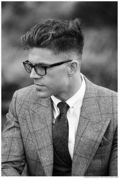 Textured, wavy top with a medium fade on the sides and back