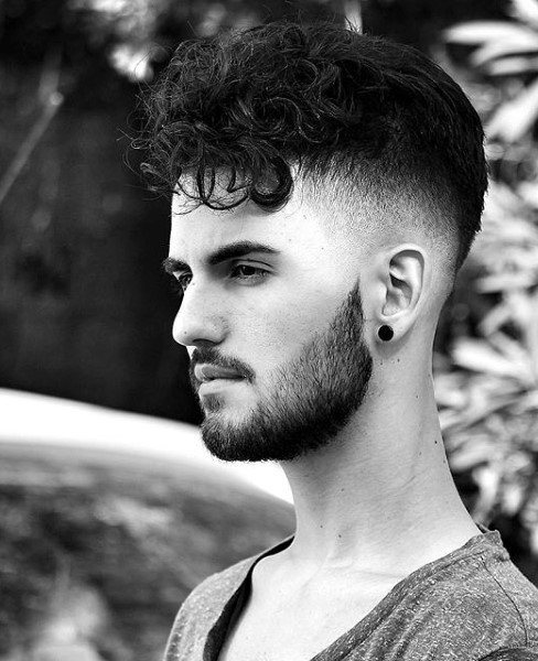 Mens Medium Length Curly Hairstyle With Skin Fade Sides