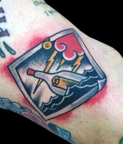 Stormy sea tattoo with clouds, lightning, and a mysterious message in a bottle