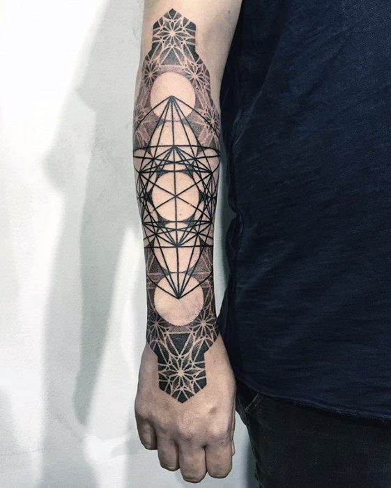 Full forearm Metatron’s Cube tattoo with bold black lines, sacred geometry, and intricate mandala patterns at the wrist and elbow.
