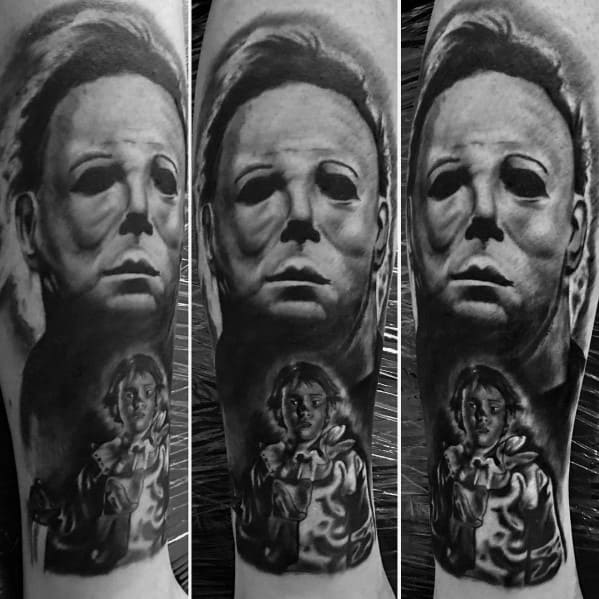 Black and gray Michael Myers tattoo featuring his eerie mask and a young child version of him in a clown costume holding a knife.