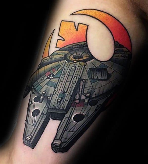 Millennium Falcon tattoo with vivid colors and Rebel Alliance symbol in the background, blending realism with bold comic-style art.