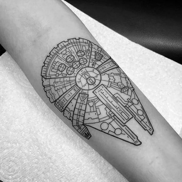 Highly detailed black line Millennium Falcon tattoo with intricate paneling and symmetrical layout on the forearm.