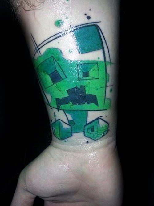 Artistic Minecraft Creeper tattoo on the wrist, with abstract sketch lines, bold green blocks, and a stylized pixelated design.